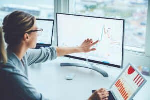 Woman studying financial chart